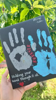 someone holding up a handprint that says, helping your hand through it's all