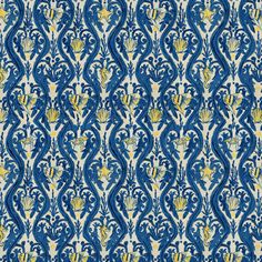 a blue and yellow wallpaper with an ornate design