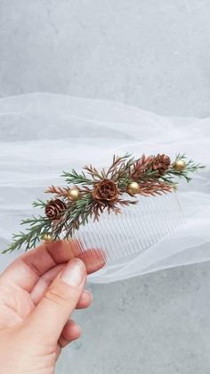 Floral hair comb for bride, bridesmaid, or flower girl Comb size - 8,5 cm (3,5 inches) Length of floral part ~ 12-13 cm (5 inches) Matching boutonniere, flower bracelet, hair crown can be made to order along with this accessory here: https://www.etsy.com/listing/735358517 Explore more items at mavkastore.etsy.com Christmas Wedding Hair, Greenery Hair Piece, Gold Wedding Hair Piece, Bridal Flower Hair Comb, Heather Wedding, Bridal Crown Crystal, Pearl Bridal Headpiece, Winter Wedding Hair, Bridal Floral Crown