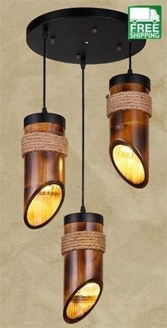 three lights that are hanging from a ceiling