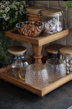 three tiered tray with glass cups and nuts