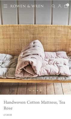 an image of a bed that is on the floor with blankets and pillows in it