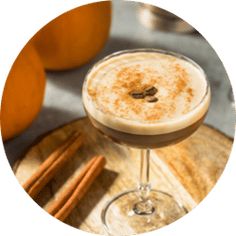 an image of a drink with cinnamons on the side