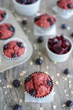 blueberry muffins with fresh berries and oatmeal in the background