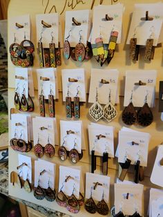 there are many different types of earrings on display