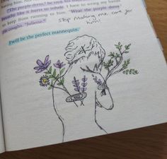 an open book with a drawing of a person holding flowers