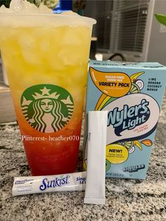 a drink and some candy sitting on a counter