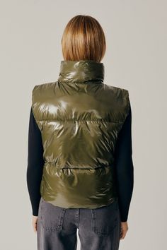 Green is the new black. Hues of green are SO in for Fall/Winter. We love the glossy finish on this gorgeous vest. So many layering options! Materials: Outer Shell 100% Nylon, Lining: 100% Polyester Sleeveless Puffer Jacket, Vest Puffer, Puffer Gilet, Army Colors, Puffer Style, Sleeveless Puffer, Surf Gear, Denim Sweater, Pant Shirt