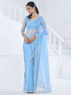 This saree is crafted from luxurious organza material in a captivating sky-blue color with intricate Swarovski work all over. The saree is adorned with a heavy handwork border, adding a touch of sophistication and elegance to the overall look. Paired with a matching organza blouse featuring zircon work, this ensemble is perfect for receptions, parties, festivals, or any special occasion.
This saree includes its gorgeous sky-blue color that exudes charm and elegance. The Swarovski work all over t Light Blue Saree, Organza Saree With Blouse, Lehenga Crop Top, Stitched Saree, Powder Blue Color, Lehenga Choli Wedding, Floral Lehenga, Party Wear Lehenga Choli, Reception Gown