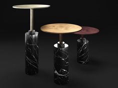 three different tables with black marble and wood tops on each side, all in various shapes and sizes