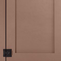 a brown door with a black handle on it