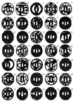 an assortment of black and white buttons with numbers in the middle, on a white background