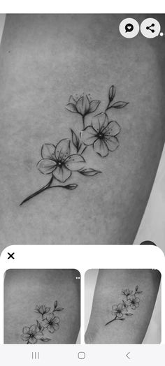 a black and white photo of flowers on the side of a woman's thigh