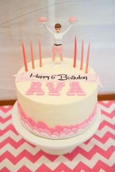 a birthday cake with a figure on top