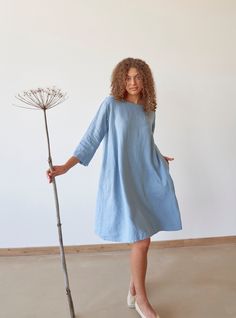 "PRODUCED in 3-5 days FAST & FREE shipping with DHL Express Courier -10% for all items with code \"FAVOURITE\" Featuring a steel blue hue and relaxed silhouette, this dress is a true secret. With a loose silhouette, it looks breezy and bohemian.  And when styled with an adjustable belt it looks elegant and graceful. Trust your feelings and choose your favorite image!  Details: - 100% Linen - Pure linen fabric - 3/4 sleeves - Boat neck - Two side pockets - Relaxed silhouette - Above knee length - Light Blue Linen Dress For Spring, Blue Linen Knee-length Dress With Relaxed Fit, Relaxed Fit Blue Linen Knee-length Dress, Blue Knee-length Linen Dress With Relaxed Fit, Linen Short Dress, Dress With A Belt, Blue Linen Dress, Cropped Sleeves, Linen Short