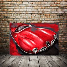 a painting of a red sports car on a brick wall in front of a wooden floor