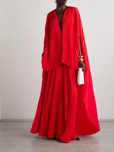 Brandon Maxwell's 'The Willow' gown is designed with a cape-effect overlay that creates the illusion of coordinating separates. It's cut from plissé-silk crepe de chine and has effortless, languid silhouette. Complement the striking shade of red with equally bold jewels - think emeralds or pink sapphires. Luxury Red Long Sleeve Sherwani, Red Dress Movement, Elegant Luxury Sherwani With Traditional Drape, Luxury Fitted Sherwani For Festive Season, Luxury Red Sherwani For Wedding, Luxury Silk Sherwani For Designer Wear, Luxury Dori Work Sherwani For Formal Occasions, Luxury Jamawar Sherwani In Traditional Drape, Luxury Anarkali Bandhgala For Eid