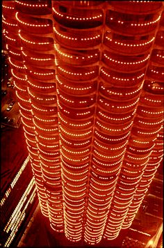 an overhead view of a building with lots of lights on it's sides and the ceiling