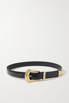 SAINT LAURENT's belt is punctured with a polished gold-tone buckle and tip that lend a decidedly Western feel. It's been crafted in Italy from glossy patent-leather and engraved with the house's moniker at the loop. Designer Hair Accessories, Denim Flats, Gold Belts, Designer Belts, Ballet Pumps, The Loop, Ski Wear, Black Patent Leather, Black Belt