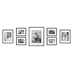 black and white pictures hanging on the wall