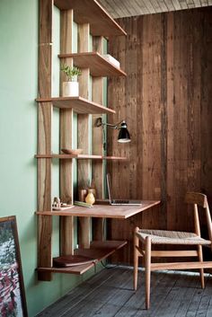 a wooden desk and chair in a room