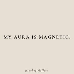 the words, my aura is magnetic are in black on a white background with an image of