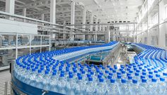 a factory filled with lots of water bottles