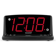 an alarm clock with red numbers on the front and back sides, showing the time