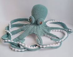 an octopus crocheted in blue and white yarn