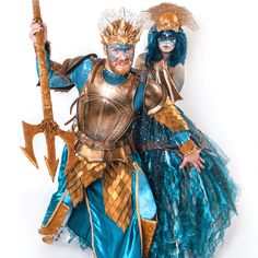 two people dressed up in costumes posing for the camera