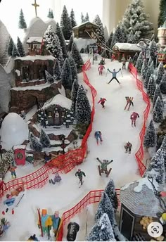 a toy ski resort with people skiing and snowboarding