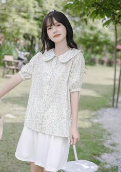 Floral printed button up shirt with a peter pan collar and short puff sleeves. S: 14.5" across shoulders, 38.5" chest, 23" lengthM: 15" across shoulders, 40" chest, 23" lengthL: 15.5" across shoulders, 41.5" chest, 23" length Softgirl Outfits, Pastel Garden, Softgirl Aesthetic, Shoe Gifts, Overall Dress, Pan Collar, Sweater Blouse, Peter Pan Collar, Cardigan Jacket