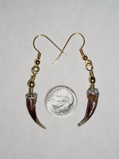 Unique handcrafted earrings made from authentic badger claws.  Claws are polished and attached to fishhook earring via a swivel. These earrings are with the smaller claw from the hind feet of a badger.  The claws measure approximately ¾" in length, No international shipping Brass Jewelry With Fish Hook For Gift, Adjustable Dangle Jewelry With Fish Hook, French Hook Drop Earrings, Unique Drop Earrings With French Hook, Fish Hook Drop Earrings As A Gift, Drop Earrings Jewelry With Fish Hook As Gift, Brass Claw Jewelry As Gift, Unique Jewelry With Fish Hook For Gift, Handmade Claw Jewelry As Gift