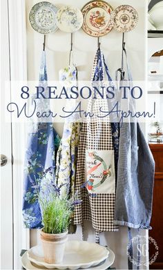 a bunch of plates hanging on a wall with the words 8 reasons to wear an apron