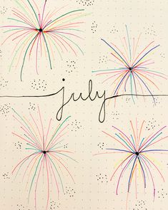 the word july written on a notebook with fireworks