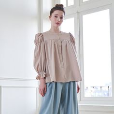 This is a beige shirring blouse with a sophisticated vibe. This blouse is made of thin and light material and is comfortable to wear. Full shirring gives a lovely atmosphere. Finished with a neat round neck No Stretch /Thin Thickness / No Sheer / Lining ▶Composition Outshell (Polyester 70% rayon27% span3%) ▶Care Only dry cleaning. ▶Share https://www.instagram.com/lbyl_official_/ 『 Returns and exchanges 』 I gladly accept returns and exchanges. Just contact me within: 14 days of delivery. Ship items back to me within: 30 days of delivery. ** I don't accept cancellations But please contact me if you have any problems with your order. [ The following items can't be returned or exchanged ] Because of the nature of these items, unless they arrive damaged or defective, I can't accept returns for: Womens Blouses, Blouse Price, Puff Sleeve Blouse, Womens Clothing Tops, South Korea, Puff Sleeve, Sleeve Blouse, Blouses For Women, Round Neck