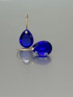 Gorgeous royal blue sapphire drop earrings. The faceted teardrops have a beautiful deep ink blue color. The drops are attached to 24K Gold Vermeil/ 14K SOLID GOLD ear wires. The earrings are elegant and have a lux look. A truly gorgeous pair of earrings. ** SOLID GOLD EAR WIRES: The ear wire ends are stamped as proof of being 14K solid gold. In addition, extra work was done at the end of the ear wires to prevent any sort of pain or injury while inserting them through the ear lobes. *AAA Flawless Sapphire Teardrop Earrings, Chanel Stud Earrings, Sapphire Drop Earrings, Sapphire Jewellery, Blue Sapphire Earrings, Ruby Earrings Studs, Extra Work, Unusual Art, Ink Blue