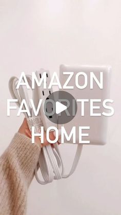 a person holding an amazon favorites home charger