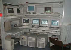 there are many computers on the shelves in this room