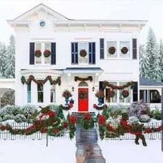 a large white house decorated for christmas with wreaths and decorations