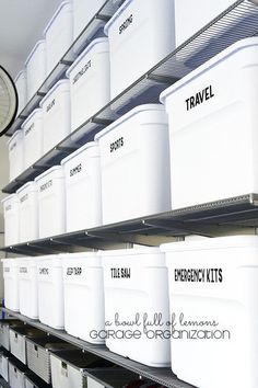 several white storage containers are on the shelves