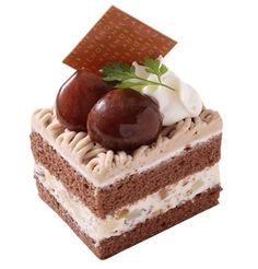 there is a piece of cake with chocolate and cream toppings on the top layer