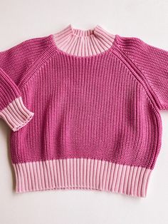 we recommend sizing down 1 for an oversized fit size down 2 for a true to size fit pink + light pink colorblock sweater 100% cotton care: machine wash cold, lay flat to dry. Pink Ribbed Collar Winter Sweater, Pink Chunky Knit Long Sleeve Top, Pink Long Sleeve Chunky Knit Top, Pink Fall Sweater With Ribbed Cuffs, Pink Winter Sweater For Layering, Oversized Pink Layering Sweater, Fall Pink Sweater With Ribbed Cuffs, Pink Chunky Knit Top For Spring, Oversized Pink Sweater For Layering