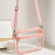 Clear With Pink Trimcrossbody Mini Handbag With Adjustable Shoulder Strap. Outside Zip Pocket. Clear Pvc With Pink Trim. Zip Top. Strap Is Adjustable. Please Note That The Zippers On The Top And Side Pocket Are A Coral Pink. A Slight Difference From The Other Trim. It Adds That Extra Dimension To Your Bag. Perfect For Festivals, Concerts, Gameday Or Sporting Events. No Top Handles Second Pic Is Of The Actual Bag You Will Receive Tags: Clear Pvc Mini Crossbody Vinyl Clutch Vegan Leather Festival Transparent Purse, Transparent Bags, Stadium Bag, Clear Purses, Transparent Bag, Stylish Shoulder Bag, Waterproof Bags, Arte Popular, Clear Bags