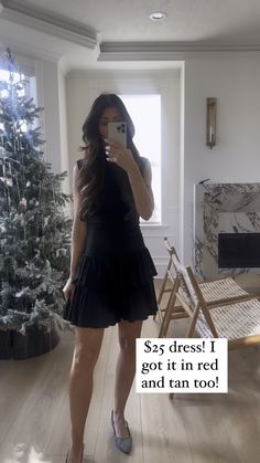 a woman taking a selfie in front of a christmas tree with the caption see dress i got in red and tan too