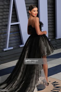 the actress in an evening gown poses on the red carpet at the vanity party for vanity magazine