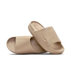 Nike Non-slip Slides, Beige Non-slip Slides For The Beach, Comfortable Non-slip Solid Color Slides, Comfortable Slide Slippers In Solid Color, Lightweight Non-slip Slip-on Slides, Casual Poolside Slip-on Slides, Breathable Slip-on Slides For Beach, Lightweight Non-slip Slides, Lightweight Slip-on Slides For Vacation