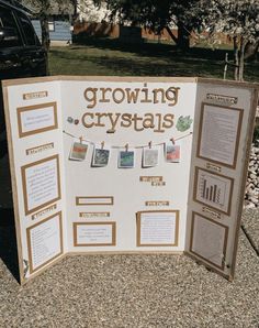 a sign that says growing crystals with pictures hanging on the clothes line and below it