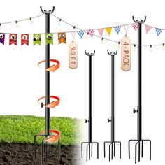 an image of a pole with flags and poles attached to it in the ground next to some plants