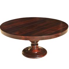 a round wooden table sitting on top of a white floor